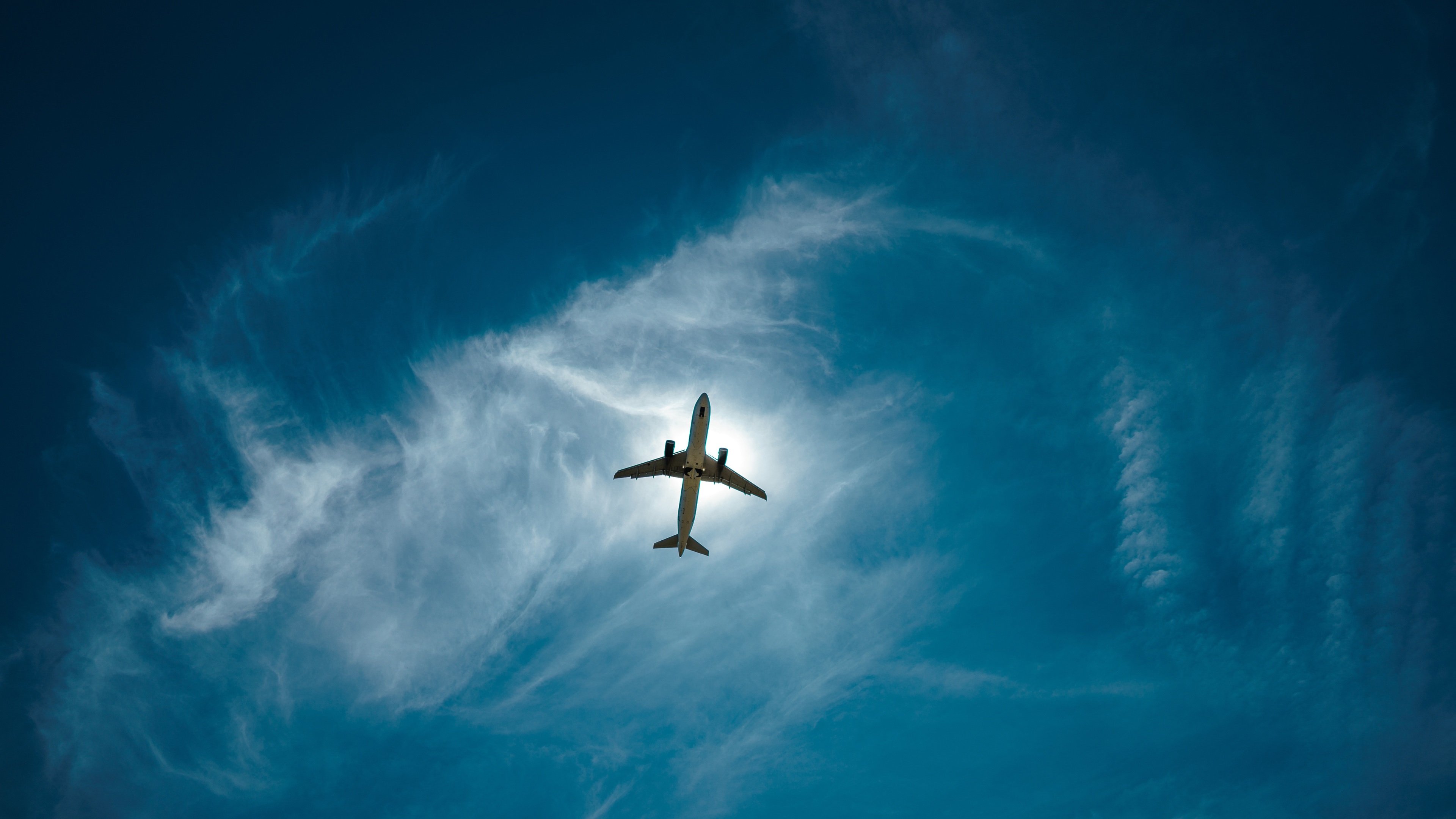 Airplane-from-bottom-view-sky-clouds-flight_3840x2160.jpg