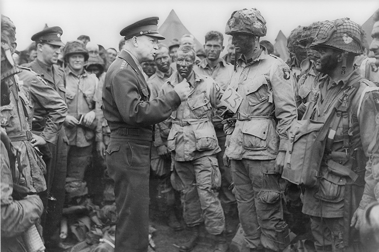 General-Eisenhower-speaks-with-members-of-the-101st-Airborne-Division-on-the-evening-of-5-June-1944.png